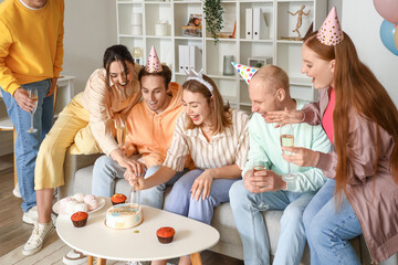Group of young friends celebrating Birthday at home