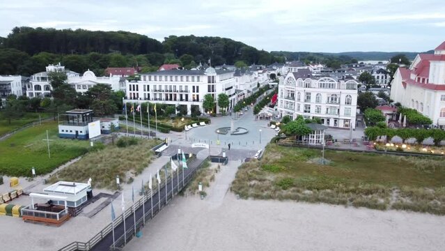 Aerial drone view -Beach in the Baltic resort of Binz shortly after sunrise, on the horizon the Kurhaus Binz, pier, Baltic resort of Binz, Ruegen Island, Mecklenburg-Western Pomerania, Germany