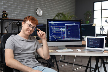 Male programmer working in office