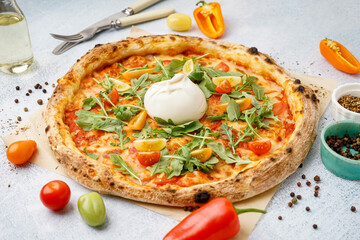 Tasty pizza with Burrata cheese on white background