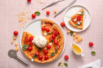 Plates of tasty pizza with Burrata cheese on pink tile background