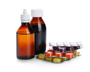 Different pills and bottles of medicines on white background