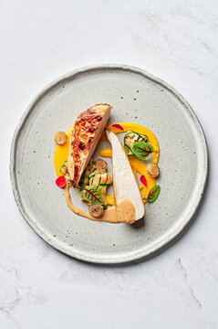 Lemon & oregano chicken breast, citrus carrot puree, cumin roasted pearl onions, zucchini ribbons, seeded mustard jus