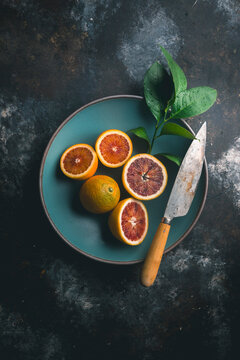 Blood Oranges and knife on Blue Bowl