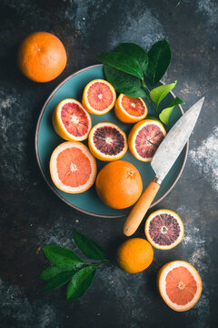 Blood Oranges, pink grapefruit and knife in Blue Bowl and table 2