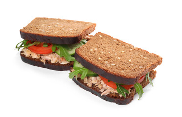 Delicious sandwiches with tuna and vegetables on white background