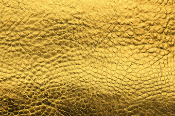 Golden textured surface as background, closeup view
