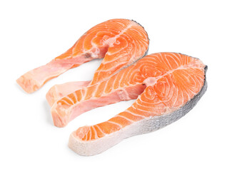 Raw salmon steaks on white background