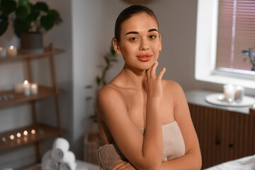 Portrait of pretty young woman in spa salon
