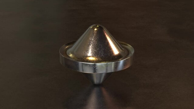 A metallic top that rotates on a metal floor
