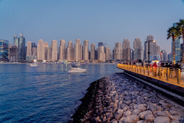 Modern new towers or residentials, business  and hotels at Marina Dubai illuminated at night with Promenade, Marina Dubai, UAE
