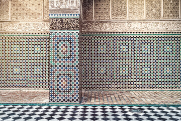 Ornamented wall with fresco or mosaic at Al Attarine Madrasa in Fez Medina, Morocco
