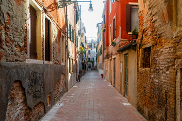 Fototapeta na wymiar Typical narrow street in Venice, Italy