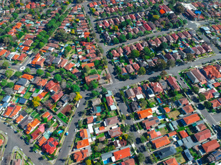 Obraz premium Panoramic Aerial Drone view of Suburban Sydney housing, roof tops, the streets and the parks NSW Australia