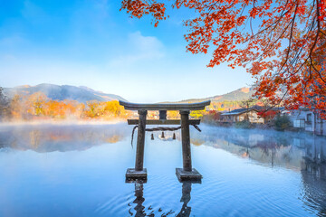 Yufuin, Japan - Nov 27 2022: Tenso-jinja shrine at lake Kinrin, is one of the representative sightseeing spots in the Yufuin area at the foot of Mount Yufu. - 632799147