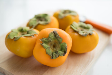 Fresh persimmon fruit in autumn season