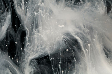 Abstract paint splash isolated on black background. Acrylic ink in water. selective focus.