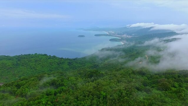 Aerial view Mist hovered over the mountains at three beaches viewpoint..scenery islands in blue sea. beautiful white sand beaches along Phuket island..The beauty of nature and the perfect city..