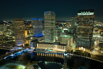 Aerial view of downtown district of Tampa city in Florida, USA. Brightly illuminated high...