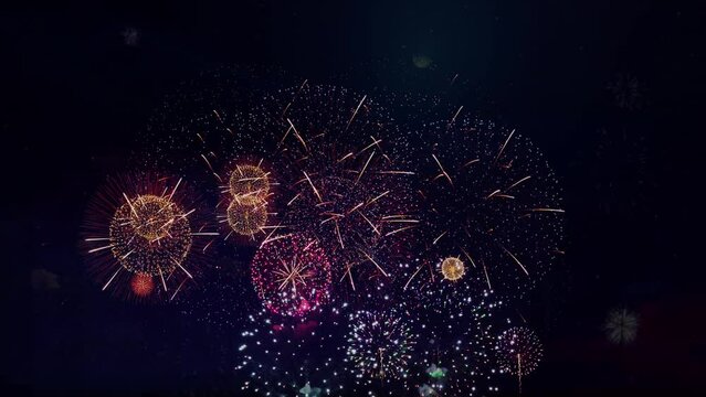 4K Real colorful fireworks show festival in the sky display bokeh lights in the night sky. national holiday, new year party or celebration event. glowing eve fireworks. independence day, 4 of July