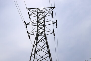 Power electric pole with line wires on insulators.