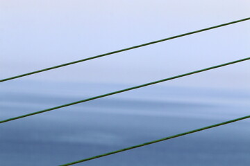 Power electric pole with line wires on insulators.