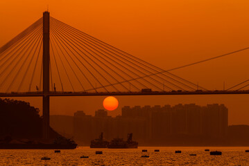 Suspension bridge in Hong Kong under sunset