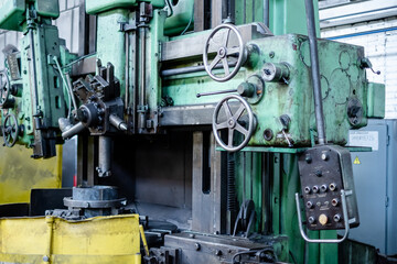 Control panel of an old metalworking machine. Replacement of old machines with new robotic machines.
