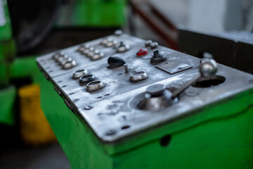 Control panel of an old metalworking machine. Replacement of old machines with new robotic machines.