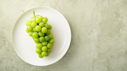 Shine Muscat, green grapes on a plate