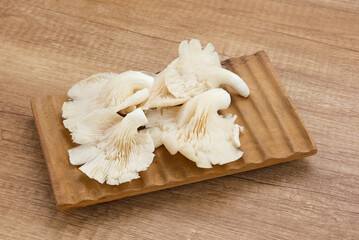 Jamur Tiram (Pleurotus ostreatus) served on bamboo plate

