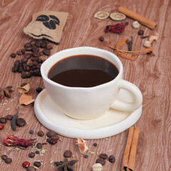 Obraz na płótnie Canvas cup of coffee with cinnamon and anise