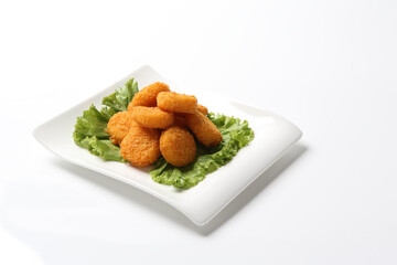deep fried crispy golden scallops or chicken or fish nugget green salad in plate on white background design appetiser food dim sum snack halal menu for Hong Kong cafe