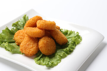 deep fried crispy golden scallops or chicken or fish nugget green salad in plate on white background design appetiser food dim sum snack halal menu for Hong Kong cafe