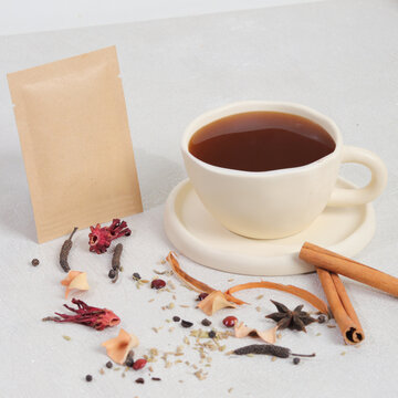 cup of tea with cinnamon sticks and flowers