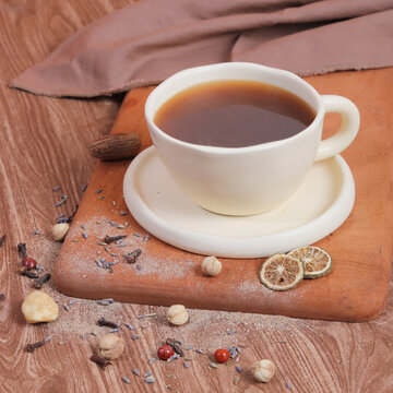 cup of tea with cinnamon sticks and spices