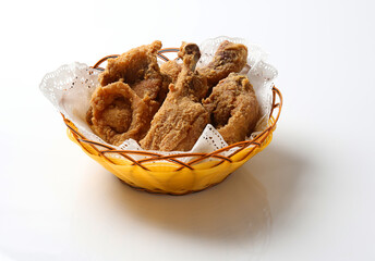 deep fried crispy chicken meat in bamboo basket on white background design appetiser fast food dim sum snack halal menu for Hong Kong cafe