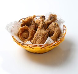 deep fried crispy chicken meat in bamboo basket on white background design appetiser fast food dim sum snack halal menu for Hong Kong cafe