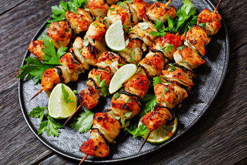 chicken souvlaki with parsley and lime on plate