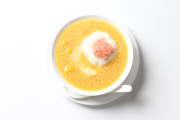 chilled mango sago fruit with pomelo and soya pudding jelly in white bowl on clean background sweet dessert pastry menu for Hong Kong cafe