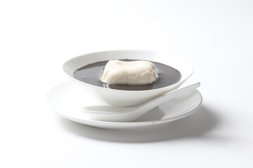 chef boiled cook thick black sesame sweet hot soup with soya milk pudding jelly in white bowl asian Chinese traditional dessert halal food vegan menu for hong kong cafe