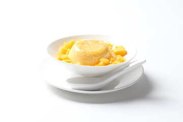 chilled mango sago fruit with pomelo and soya pudding jelly in white bowl on clean background sweet dessert pastry menu for Hong Kong cafe