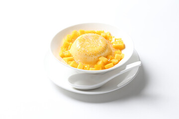 chilled mango sago fruit with pomelo and soya pudding jelly in white bowl on clean background sweet dessert pastry menu for Hong Kong cafe