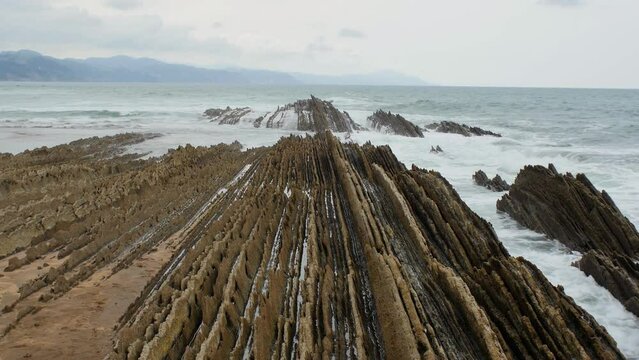 Static view of continuous rock strata, Itzurun Beach Zumaia Spain