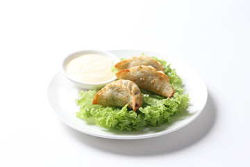 deep fried crispy meat dumpling wanton har gao in vegetable salad plate appetiser breakfast dim sum Halal food menu serve with tartar salad sauce for Hong Kong cafe