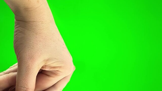 woman gives a hand to a man a man strokes her on a green background chromakey close-up approval pity love warm
