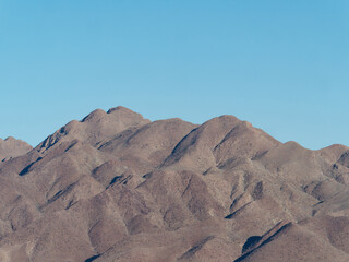 Close-up photo of the top of the Naukluft Mountain with a clear blue sky in the background in the Namib Naukluft National Park, Namibia