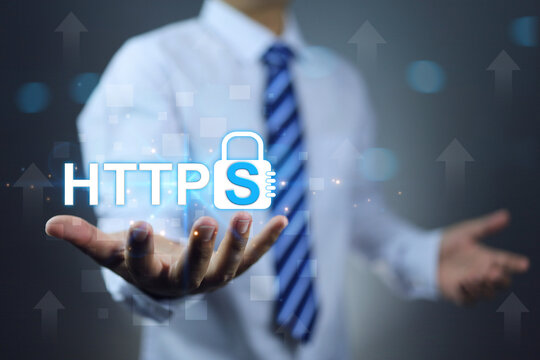 https secured internet concept. Businessman or programmer holding address security website on hand represent more security  domain and https text on log symbol.