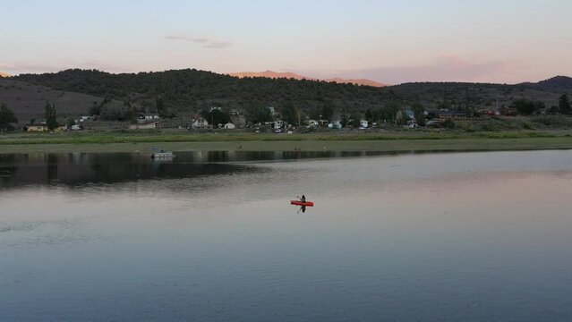 kayak on lake during sunset