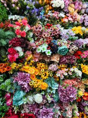 Artificial decorative flowers and plants, plastic flower decorations photography, floral wallpaper, colorful nature background 